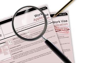 Magnifying Glass on Work Visa Application