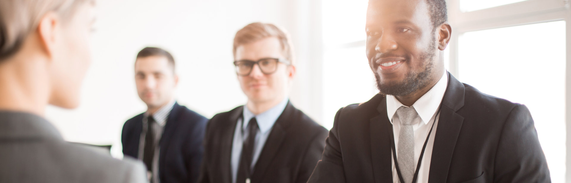 group of professional man talking to a woman